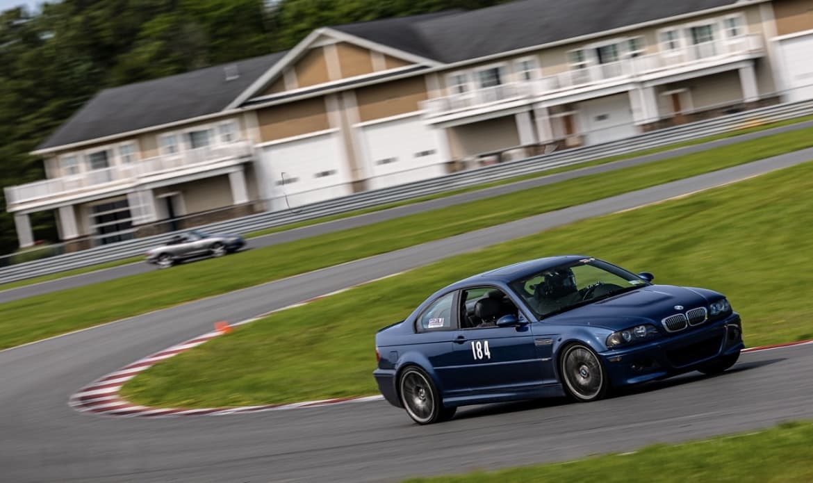 Felix's blue BMW E46 M3 (#184) on a Northeast HPDE track